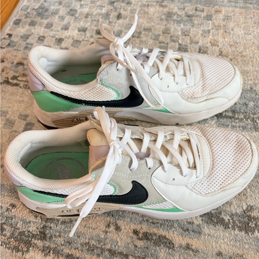 White and Green Sneakers with Black Swoosh
